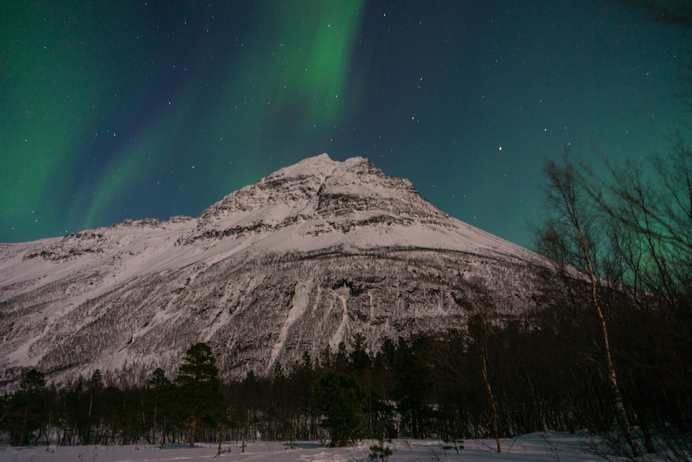 landscape photography of snow mountain under aurora borealis