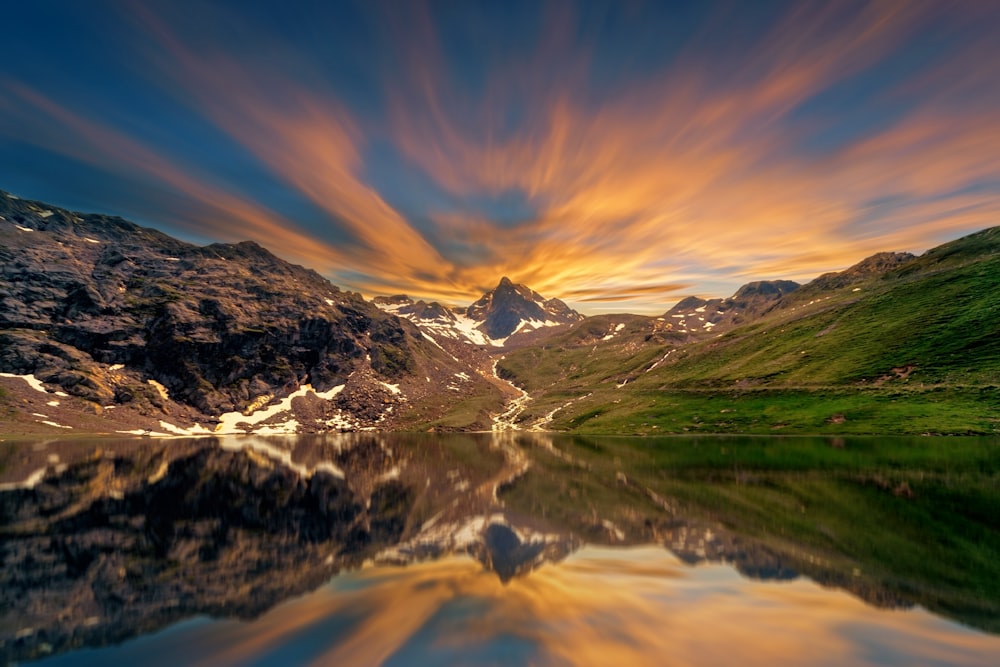 reflection photo of trees and mountain