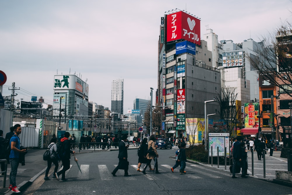 people crossing in pedestrian lane