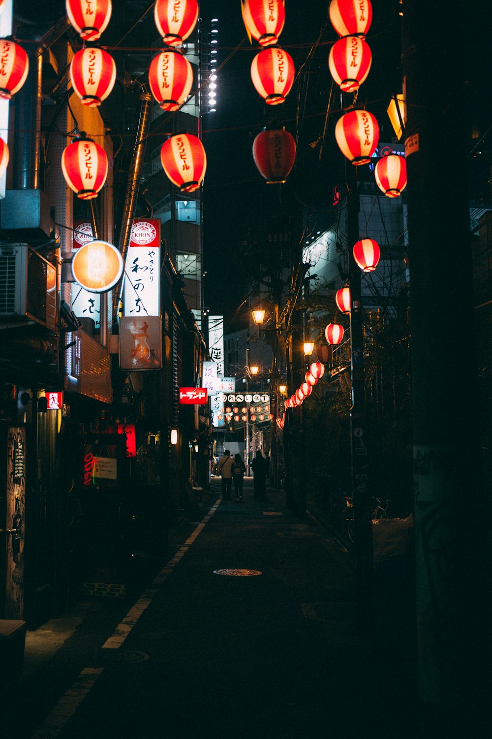 unknown persons walking on alleyway