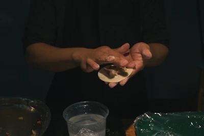 Chef Pak Met skillfully preparing bakmi dough by hand.