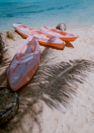 three empty kayaks
