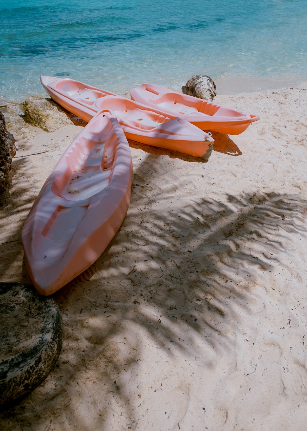 three empty kayaks