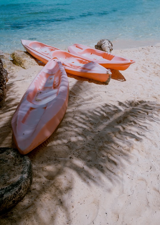 three empty kayaks in Alona Beach Philippines