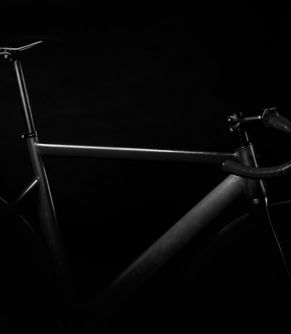 black road bike on against black background