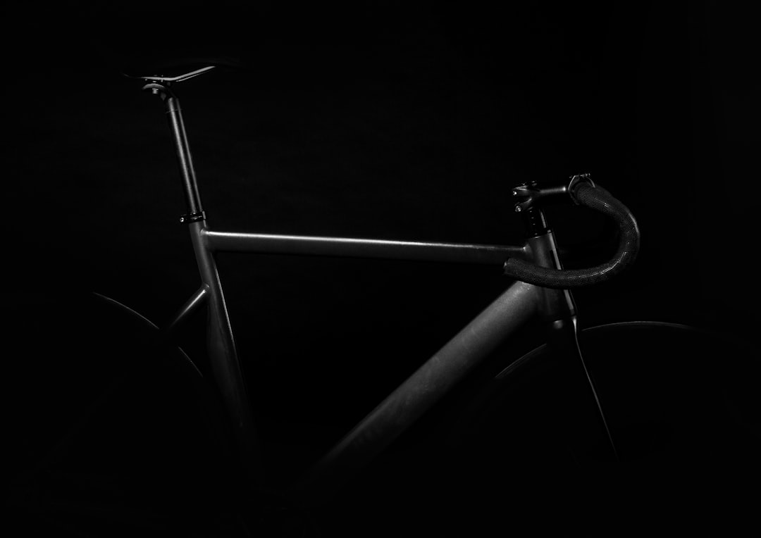 black road bike on against black background