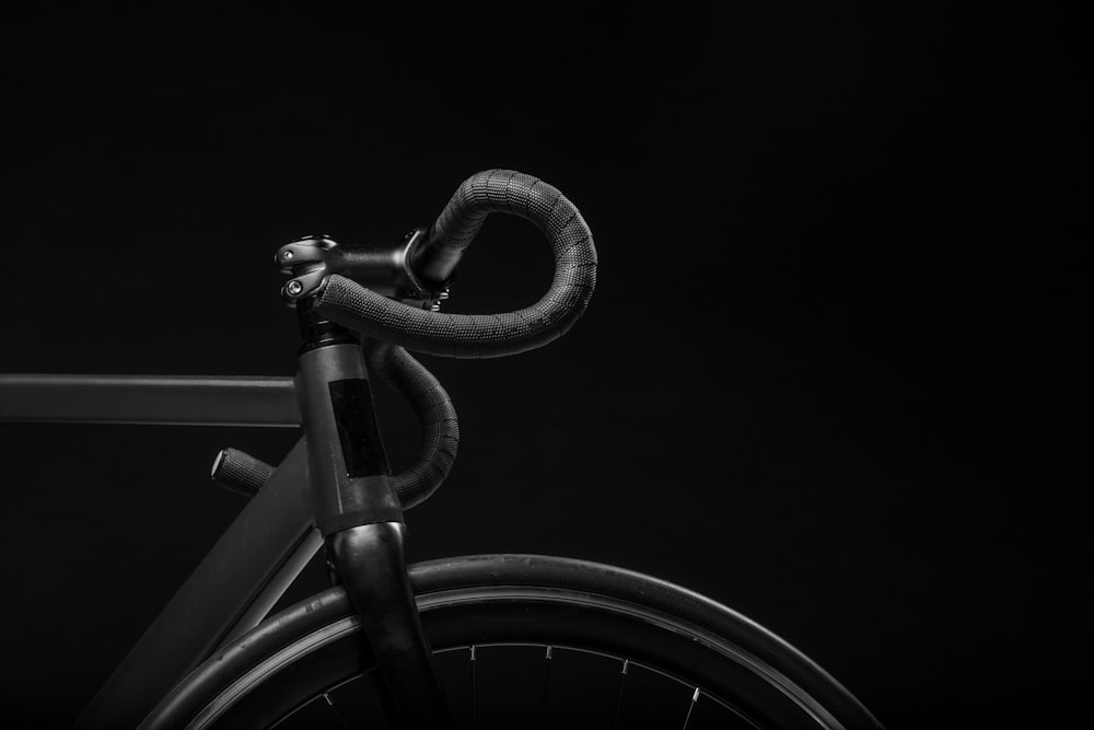 black road bicycle handle with black background