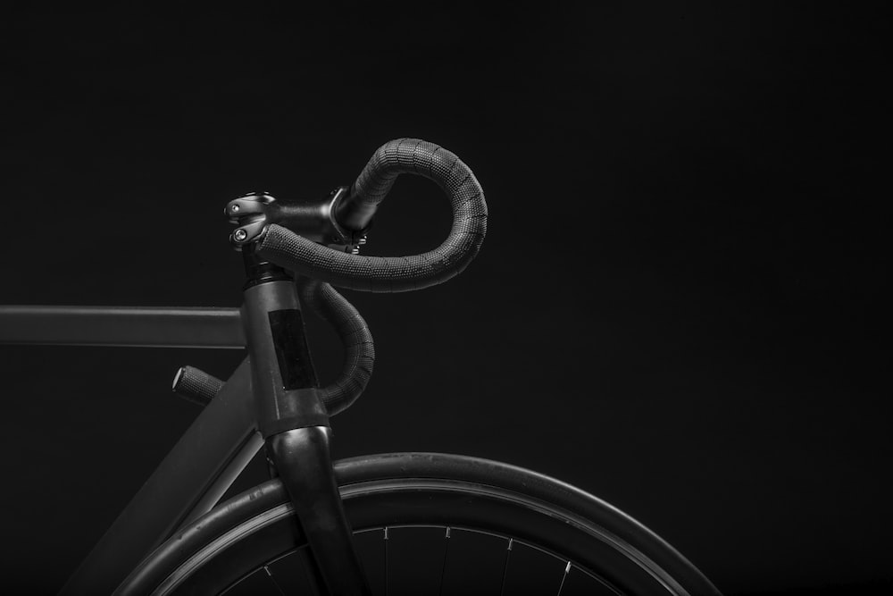 black road bicycle handle with black background