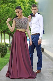 A stylish couple showcasing coordinated outfits.
