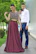 Couple posing confidently in fashionable matching clothes from éclat jardin on a city street.