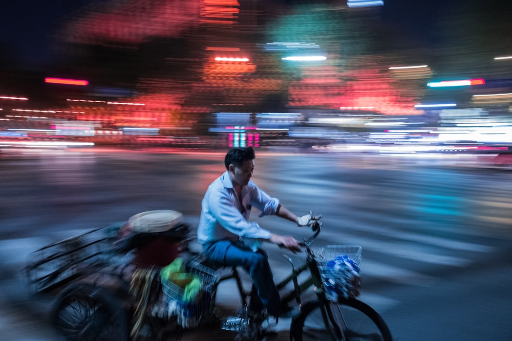 man pedaling his trike