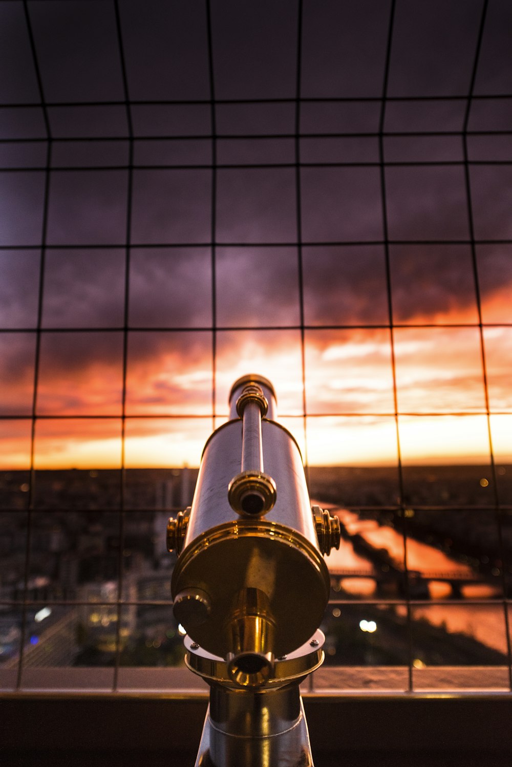 gray and yellow telescope against grill