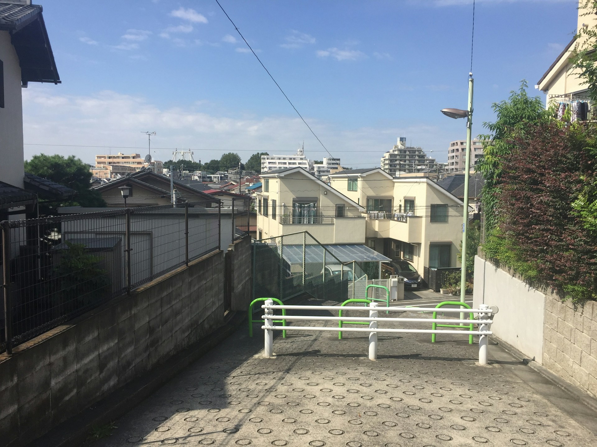 woman wearing yellow long-sleeved dress under white clouds and blue sky during daytime