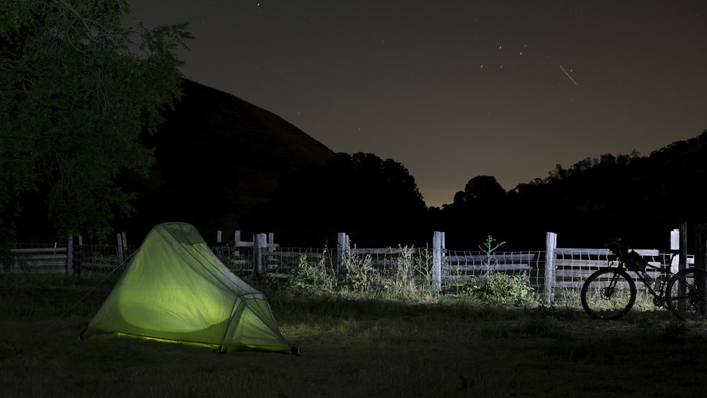 green outdoor tent on green grass