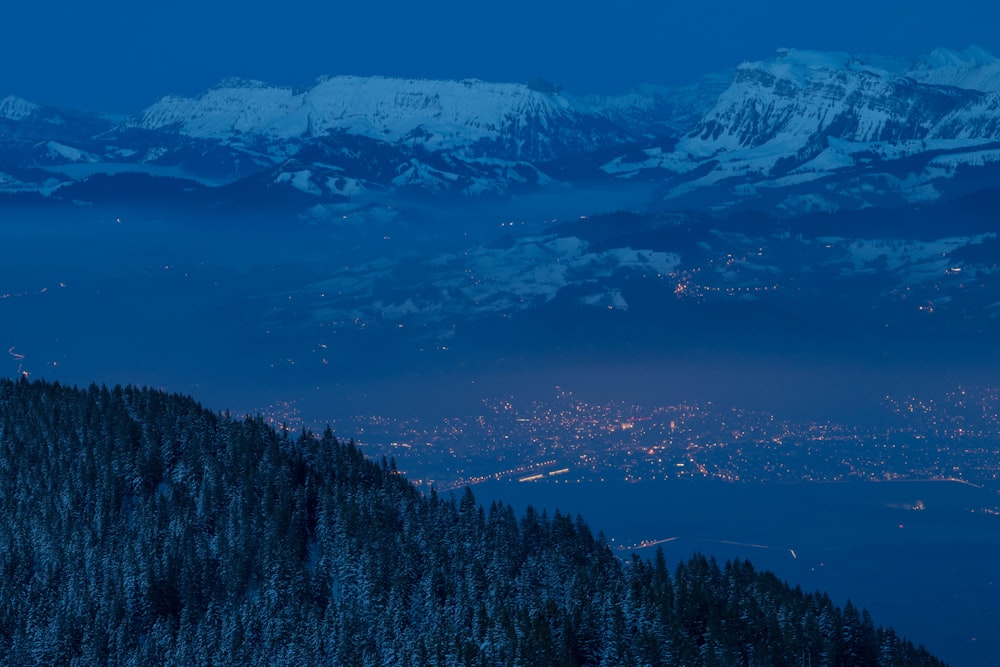 lighted house in city near glacier mountain at nighttime