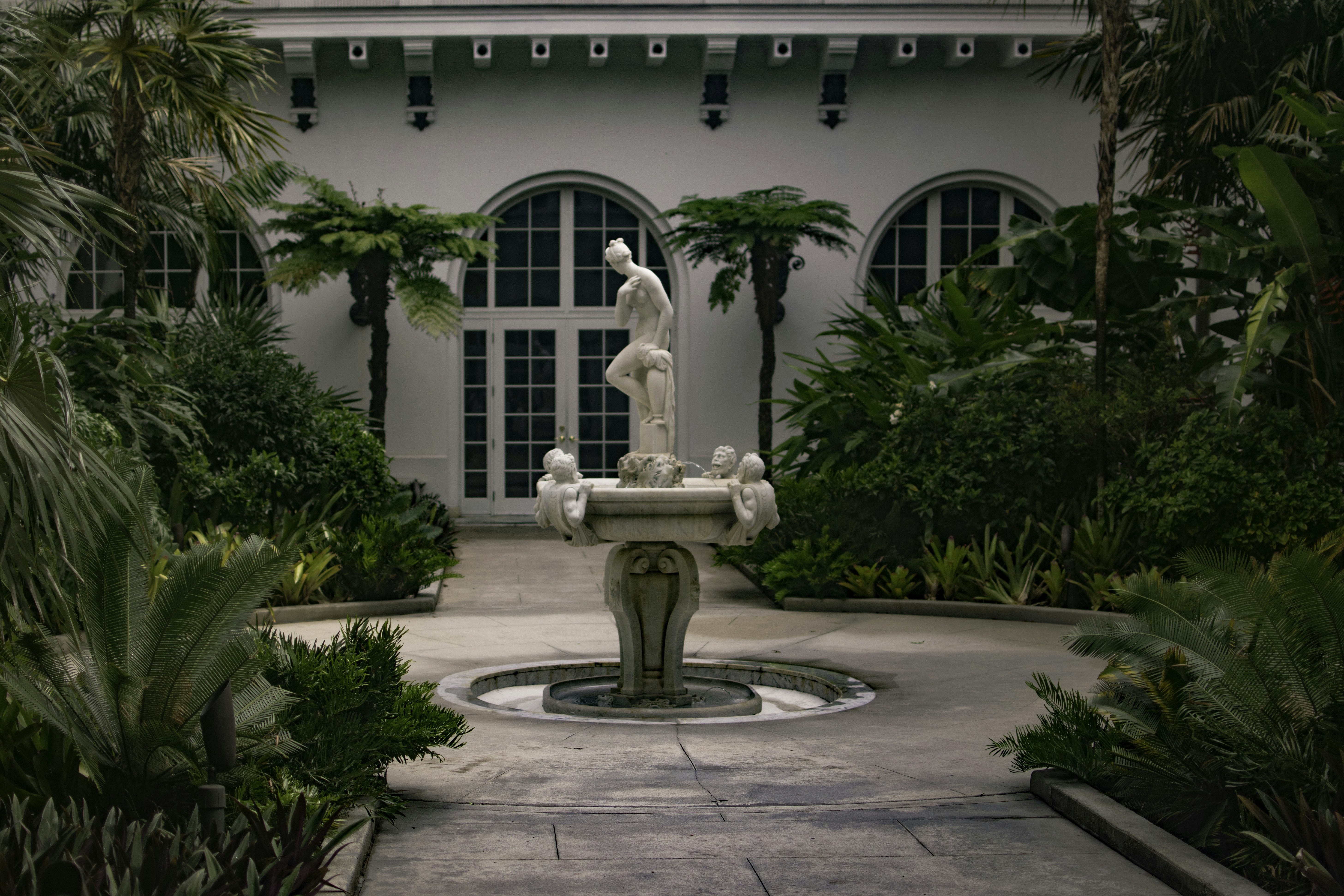 Luxury custom sculptural fountain with intricate carved stone details
