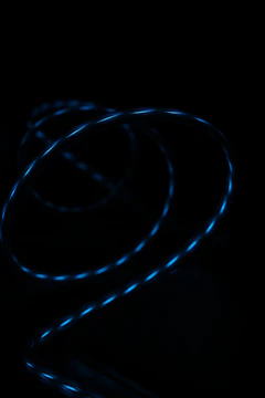 Creative 3D logo animation with glowing blue highlights on black background.