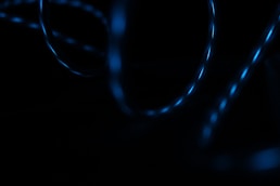 A dim shot of a glossy spiral against a dark background