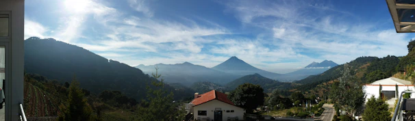A panoramic view of a premium land plot in Tangier with clear skies and distant mountains.