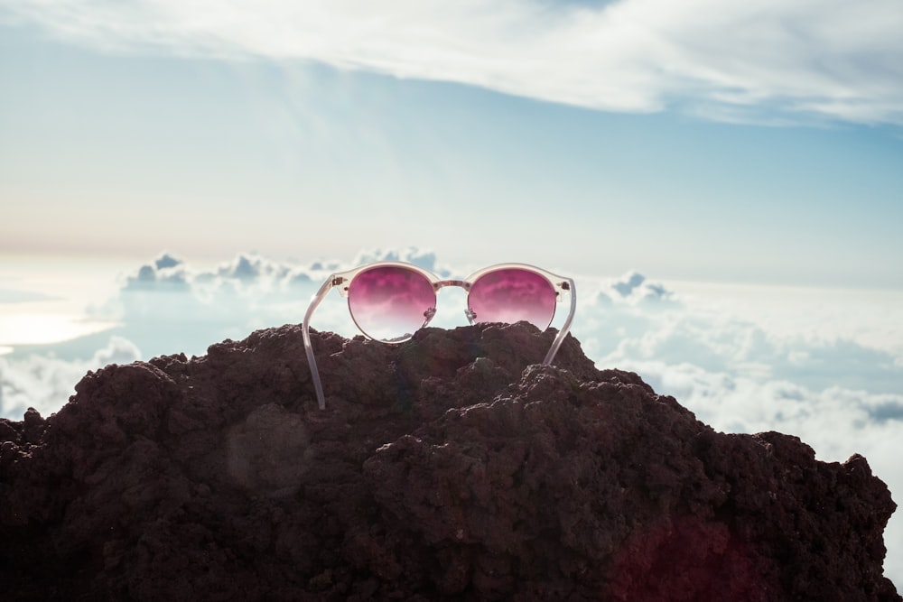 sunglasses on rock