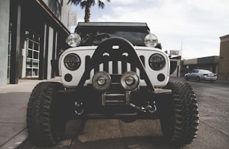 white Jeep Wrangler on off road car tyres