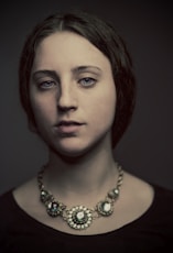 portrait photography of woman in black top