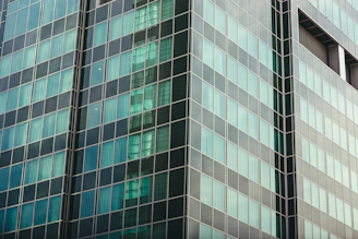Exterior view of a modern law office building with glass facade.
