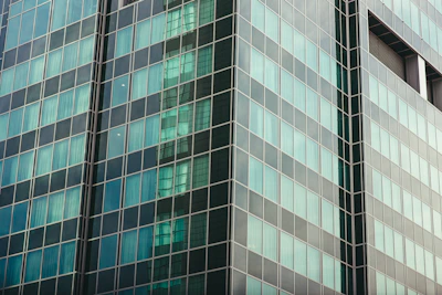 3D exterior render of a contemporary office building with glass facade.