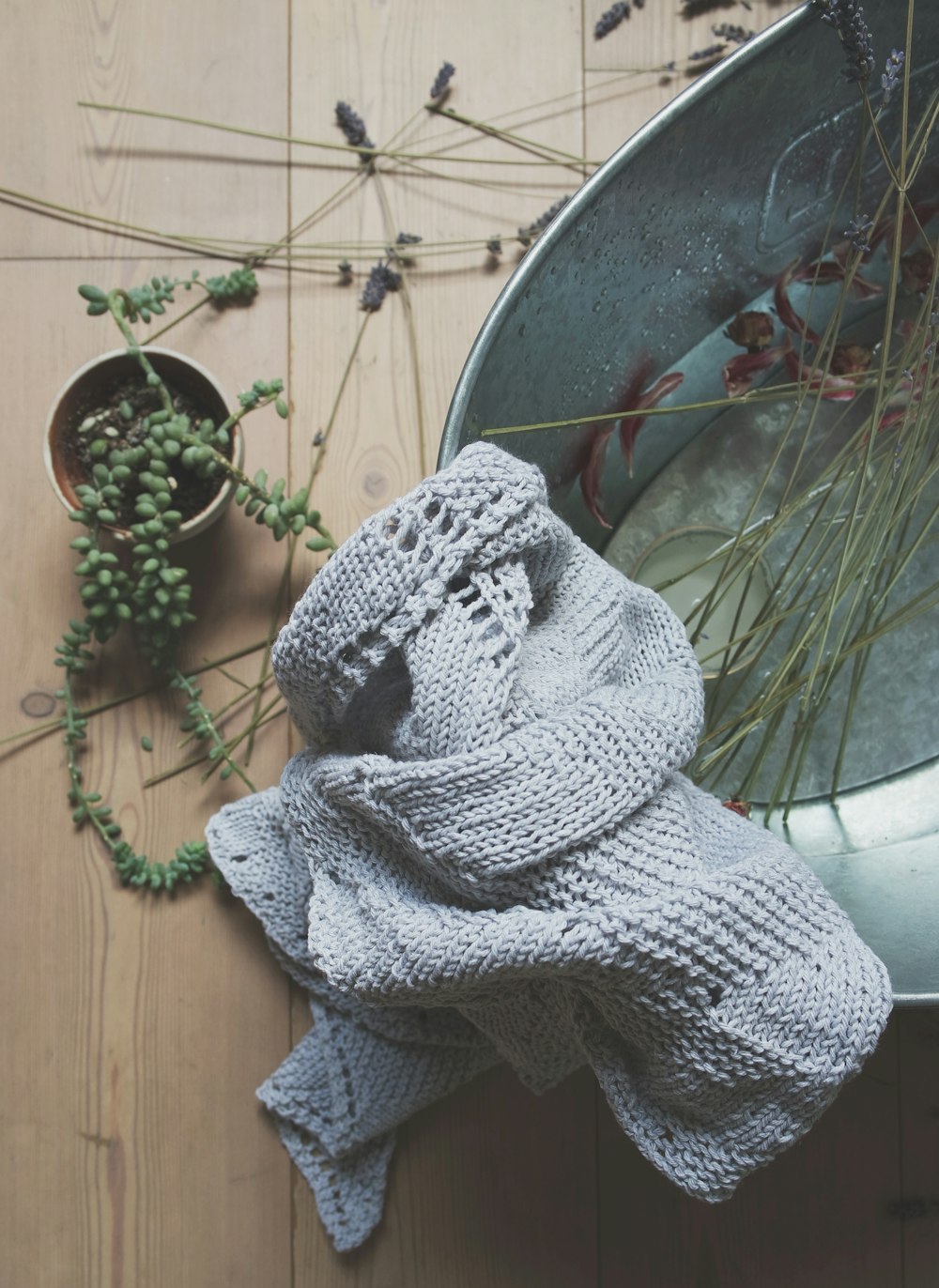 gray knitted textile on stainless steel washtub