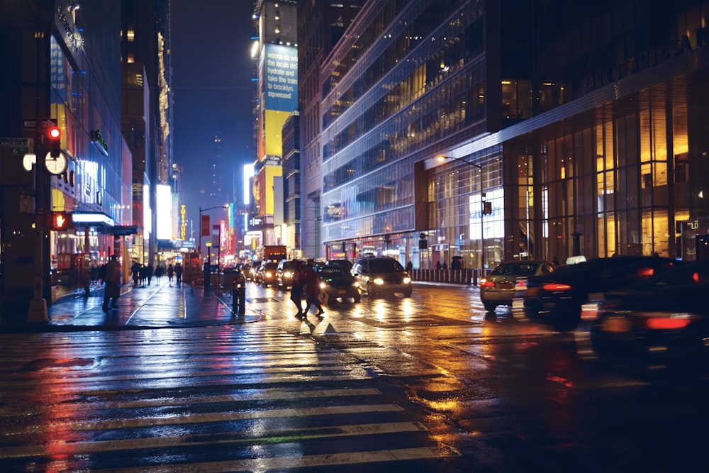 time-lapse photography of people and vehicles on road