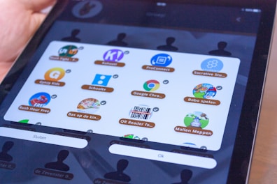 Close-up of a digital tablet displaying an educational app with ethical themes.
