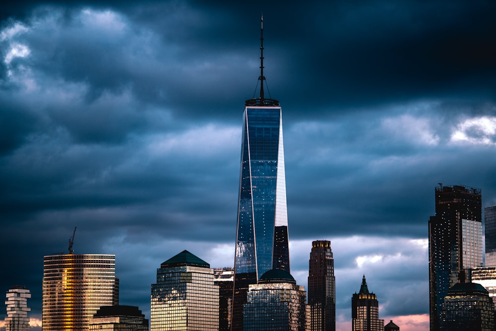 high-rise building under nimbus clouds