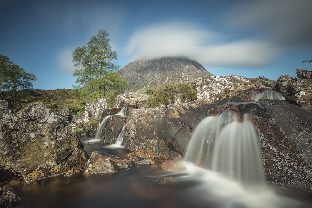 time-lapse photogrpahy of multi-step waterfalls duing daytime