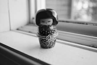 A close-up of a detailed Japanese figurine, highlighting its craftsmanship.