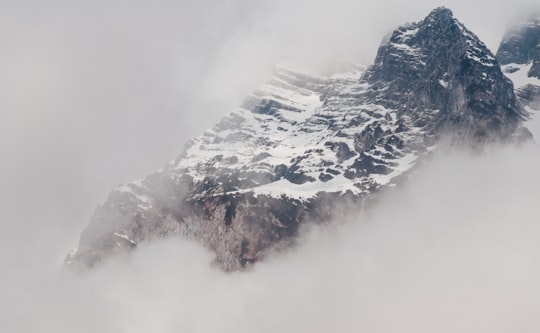 snowy mountain covered by fog in Königssee Germany