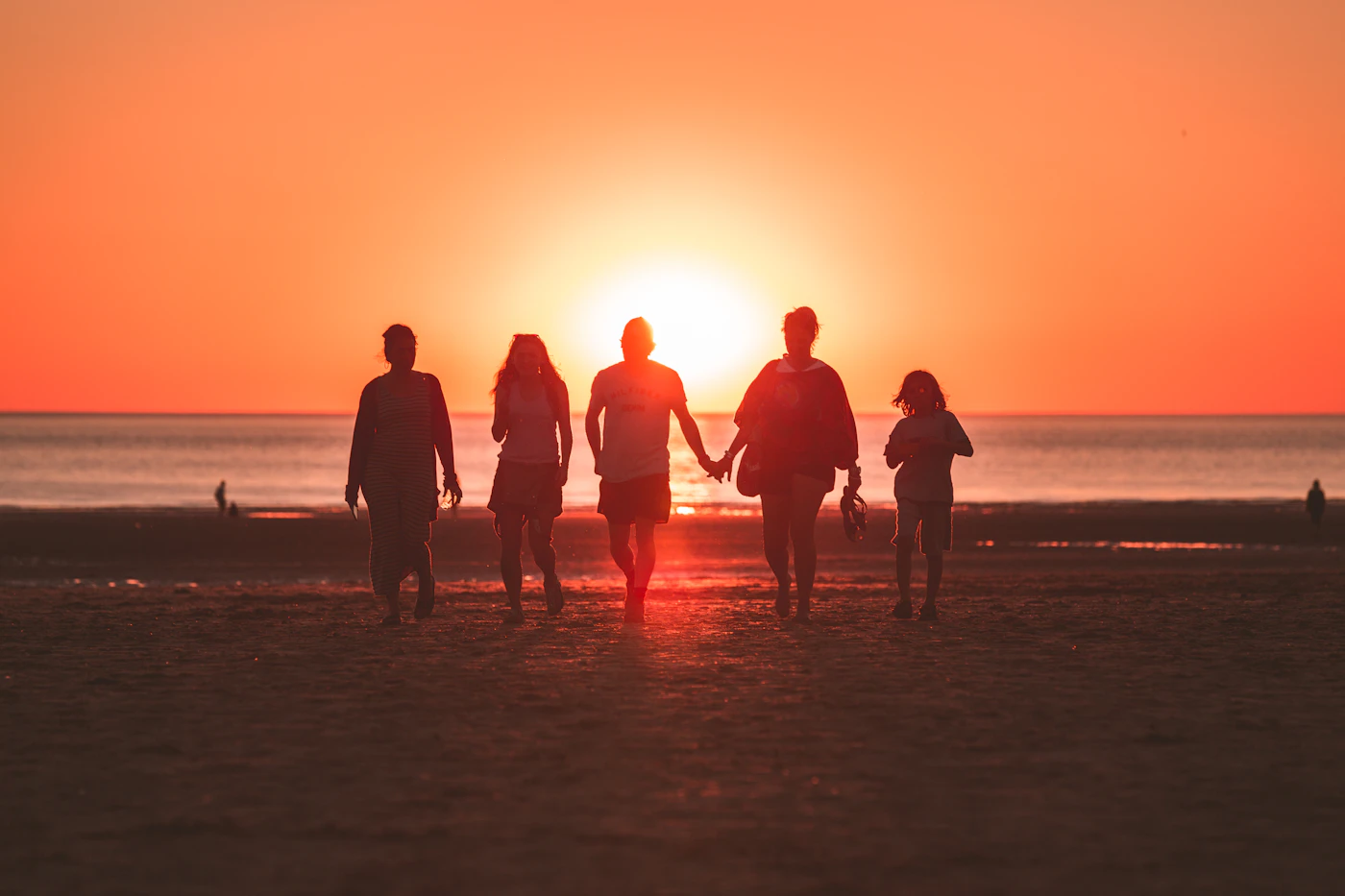 Silhouettes walking together at golden hour