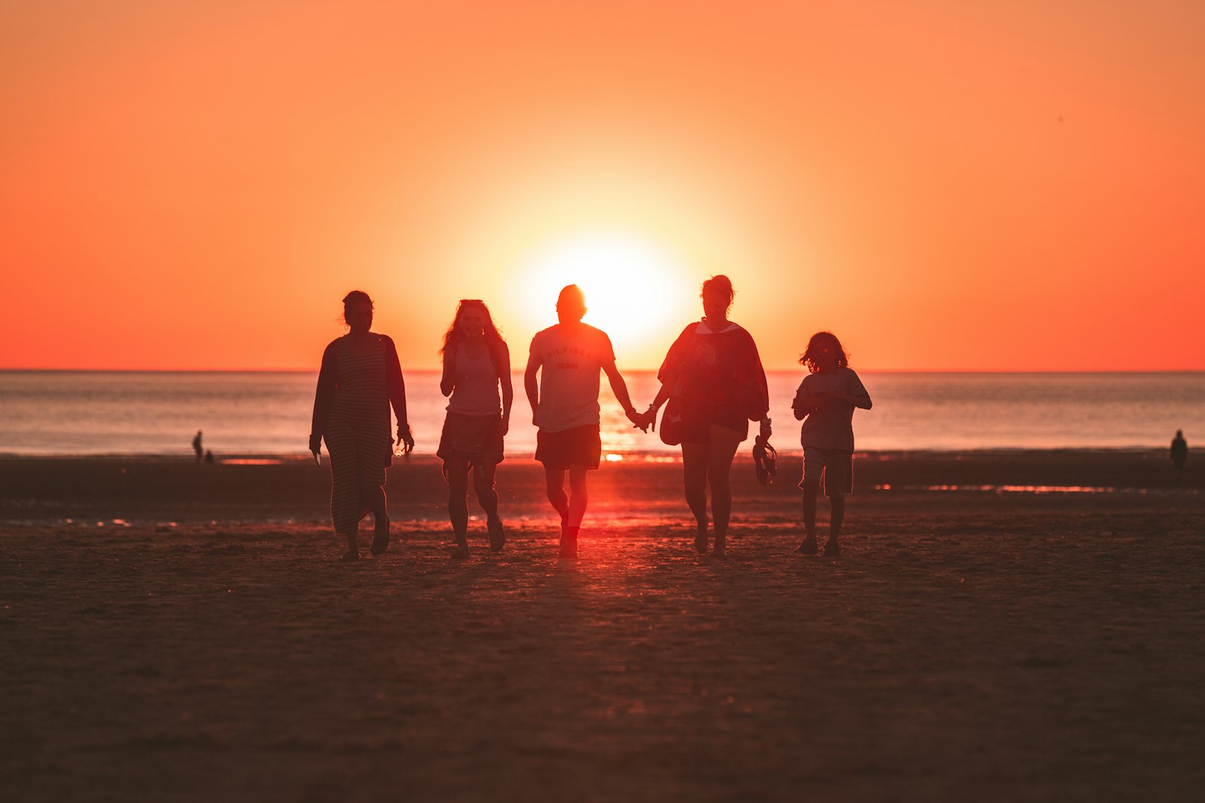 I was randomly shooting the sunset when a family decided to walk back from the sea to the beach