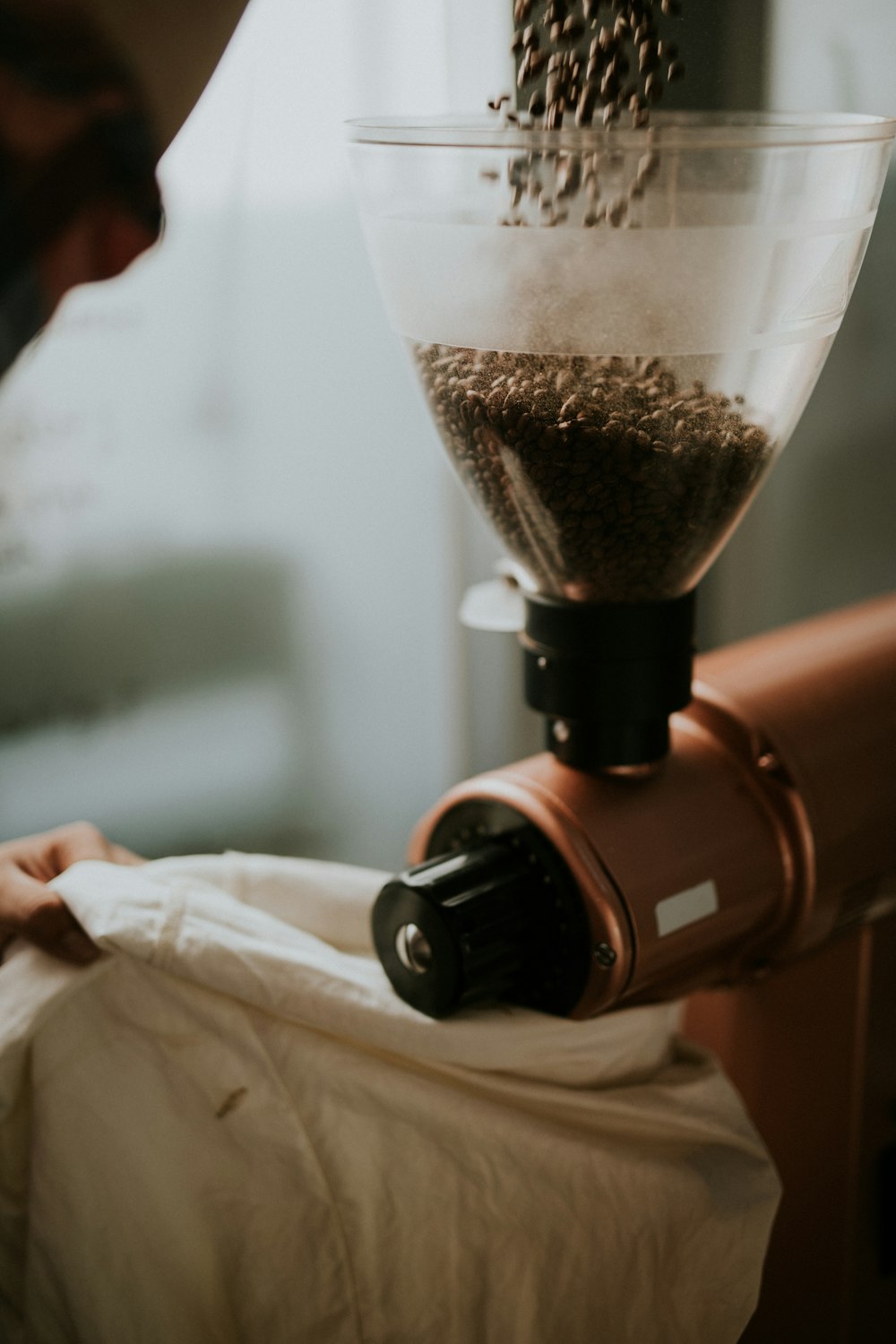 person milling coffee