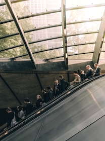 people using escalator during daytime