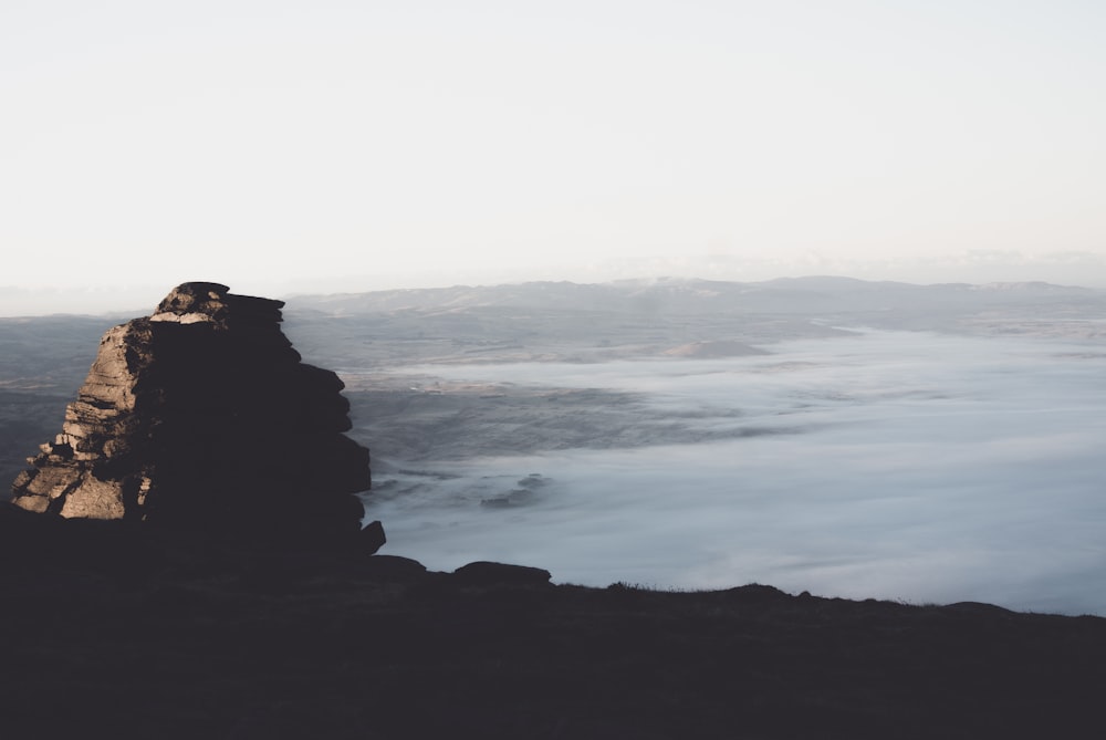 a person standing on top of a mountain