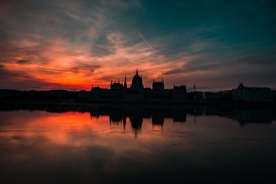 silhouette of building under gray sky during golden hour in Hungarian Parliament Building Hungary