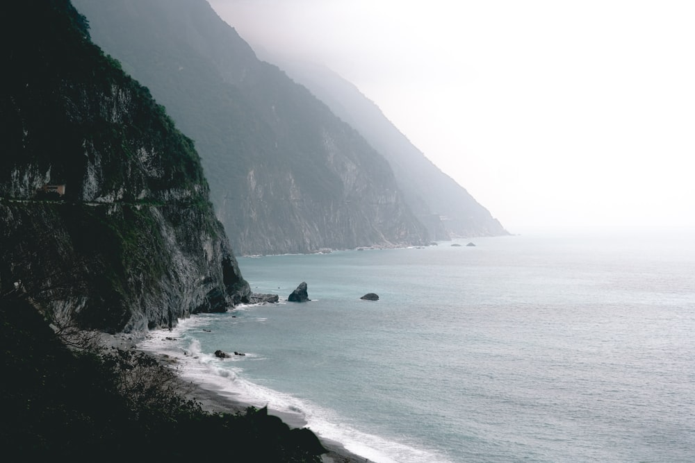 landscape of seashore near mountain