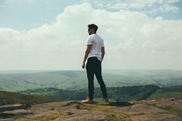 Person sitting alone looking sad and withdrawn