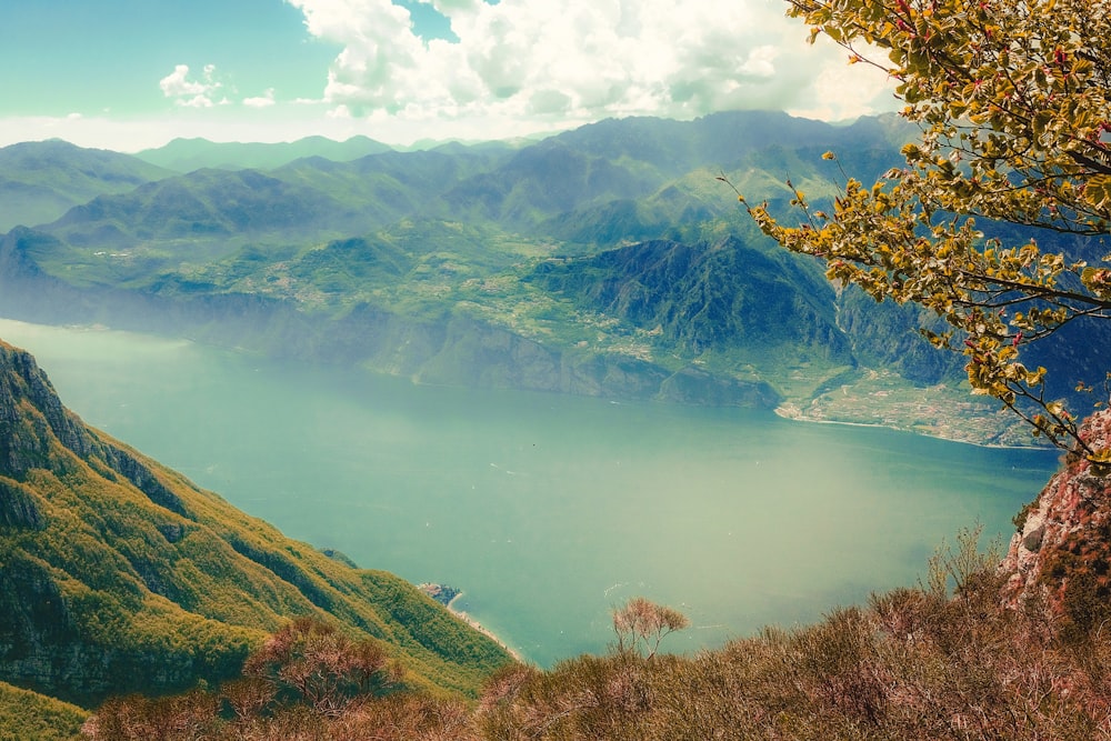 body of water surrounded with mountains