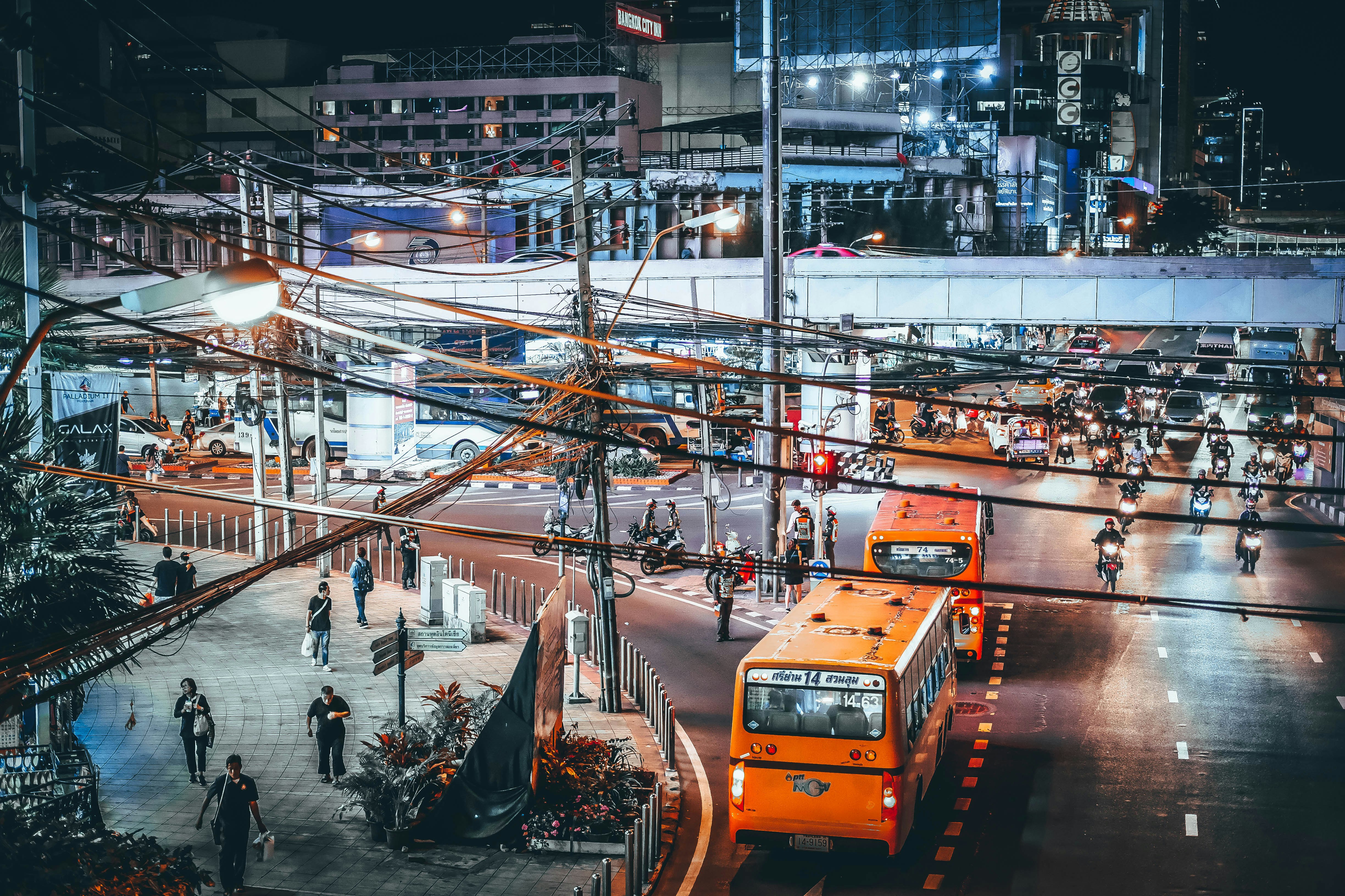 two yellow bus beside street during night time