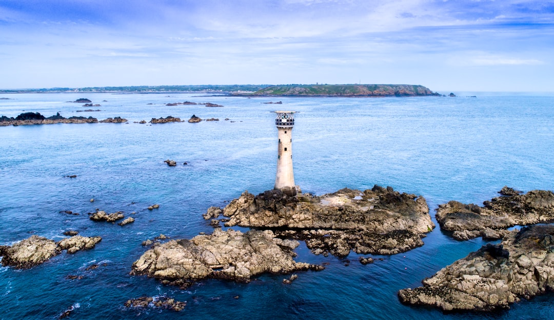 watch tower on island under blue skies