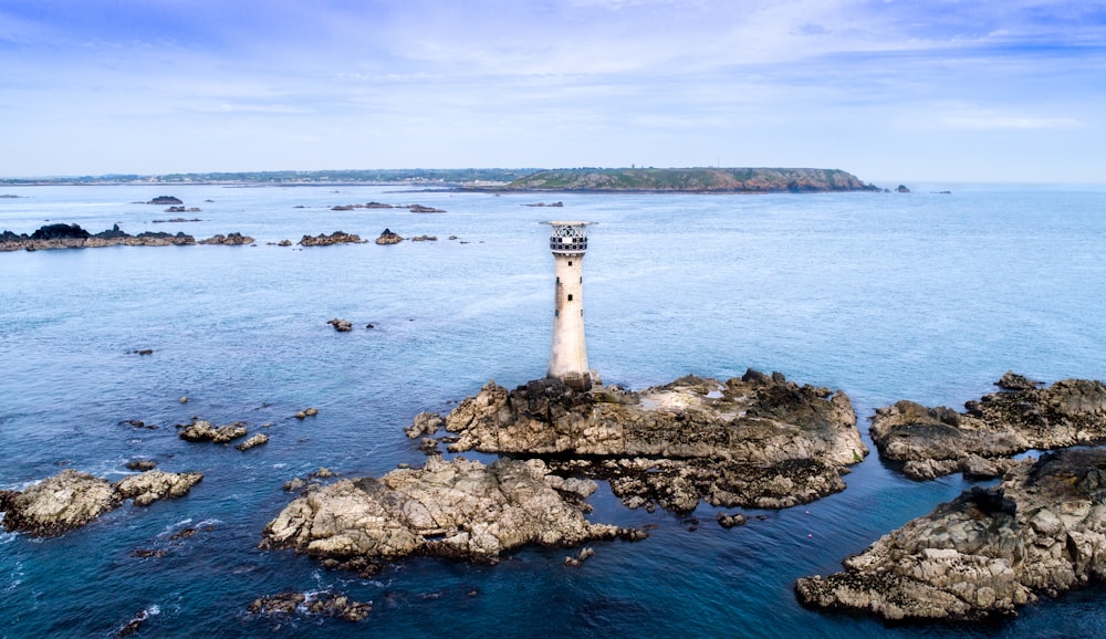 watch tower on island under blue skies