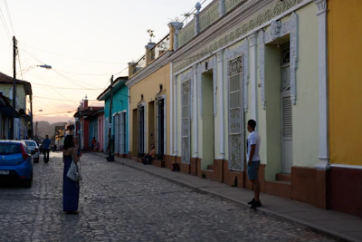 Sunset lighting bathes the colonial streets of San Miguel de Allende, highlighting colorful facades and rustic cobblestones.