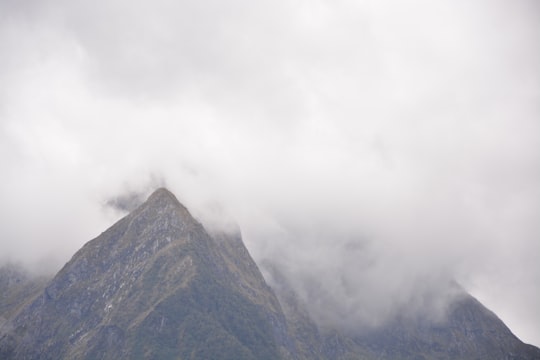 mountain view under cloudy sky during daytime in Milford Sound New Zealand