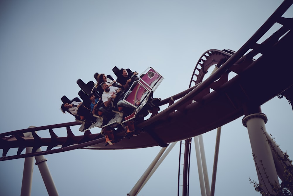 six person riding on roller coaster at daytime